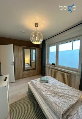 Ein Bett oder Betten in einem Zimmer der Unterkunft BEGE APARTMENTS WorkEase
