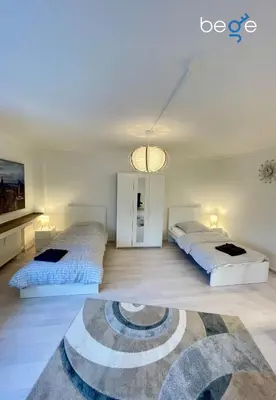 Ein Bett oder Betten in einem Zimmer der Unterkunft BEGE APARTMENTS WorkEase