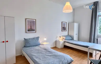 Ein Bett oder Betten in einem Zimmer der Unterkunft BEGE APARTMENTS Momentum Stay