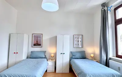 Ein Bett oder Betten in einem Zimmer der Unterkunft BEGE APARTMENTS Momentum Stay