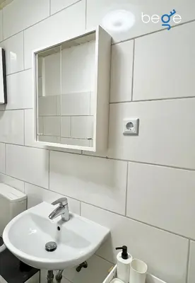 Ein Badezimmer in der Unterkunft BEGE APARTMENTS Momentum Stay