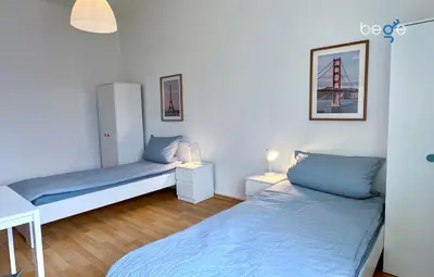 Ein Bett oder Betten in einem Zimmer der Unterkunft BEGE APARTMENTS Momentum Stay