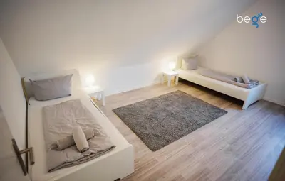 Ein Bett oder Betten in einem Zimmer der Unterkunft BEGE APARTMENTS Work Essentials