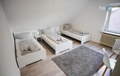 Ein Bett oder Betten in einem Zimmer der Unterkunft BEGE APARTMENTS Work Essentials