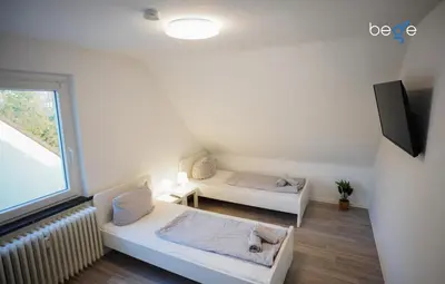 Ein Bett oder Betten in einem Zimmer der Unterkunft BEGE APARTMENTS Work Essentials