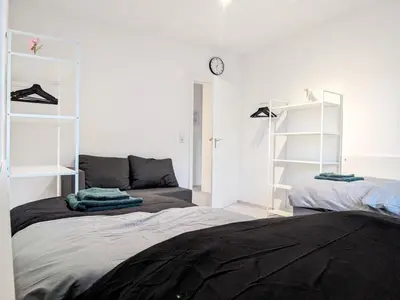Ein Bett oder Betten in einem Zimmer der Unterkunft Gleaming Apartment in Mettmann