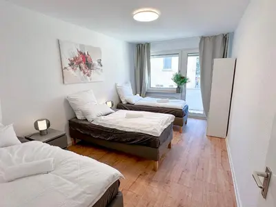 Ein Bett oder Betten in einem Zimmer der Unterkunft Modern flat - for up to 7 people