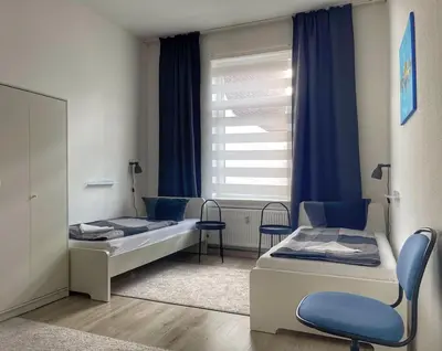 Ein Bett oder Betten in einem Zimmer der Unterkunft Ring-Apartments Gelsenkirchen, Zentrum