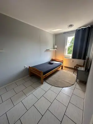 Ein Bett oder Betten in einem Zimmer der Unterkunft Monteurswohnung am Schloß 3