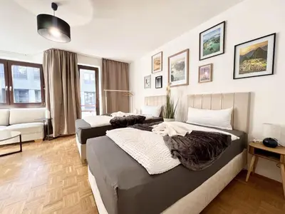 Ein Bett oder Betten in einem Zimmer der Unterkunft PrimeTimeSuites Nähe Messe & HBF