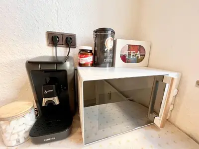 Küche/Küchenzeile in der Unterkunft PrimeTimeSuites Nähe Messe & HBF