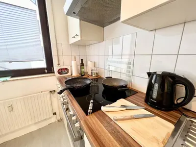Küche/Küchenzeile in der Unterkunft PrimeTimeSuites Nähe Messe & HBF