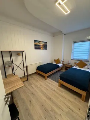 Ein Bett oder Betten in einem Zimmer der Unterkunft DERKO Apart