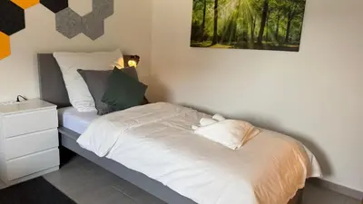 Ein Bett oder Betten in einem Zimmer der Unterkunft DUTTI'S HOME - Apartment A l 2 rooms l 4 Beds l TV l WIFI l Kitchen l Parking l Autobahn