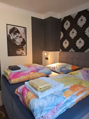 Ein Bett oder Betten in einem Zimmer der Unterkunft B&B Waldblick Hotel mit großem Parkplatz