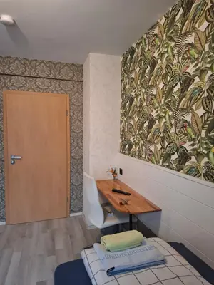 Ein Bett oder Betten in einem Zimmer der Unterkunft B&B Waldblick Hotel mit großem Parkplatz