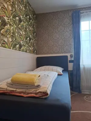 Ein Bett oder Betten in einem Zimmer der Unterkunft B&B Waldblick Hotel mit großem Parkplatz