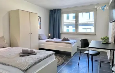 Ein Bett oder Betten in einem Zimmer der Unterkunft BEGE APARTMENTS Corporate Living