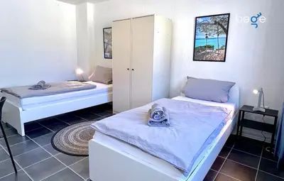 Ein Bett oder Betten in einem Zimmer der Unterkunft BEGE APARTMENTS Corporate Living