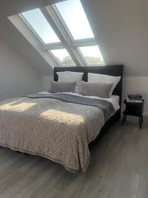Ein Bett oder Betten in einem Zimmer der Unterkunft Apartment Weitblick