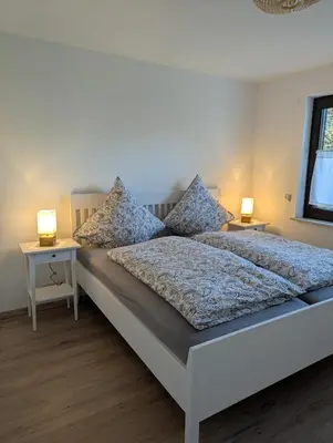 Ein Bett oder Betten in einem Zimmer der Unterkunft Helle Wohnung in Erkrath