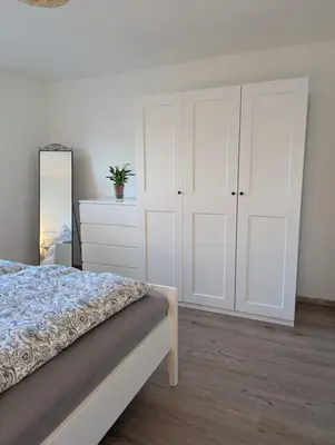 Ein Bett oder Betten in einem Zimmer der Unterkunft Helle Wohnung in Erkrath