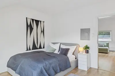 Ein Bett oder Betten in einem Zimmer der Unterkunft Dachgeschoss Traum Wohnung Ronsdorf 3 Zimmer