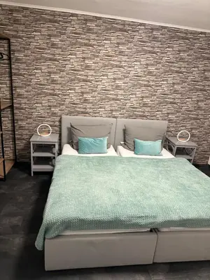 Ein Bett oder Betten in einem Zimmer der Unterkunft Smile Apartment Duisburg