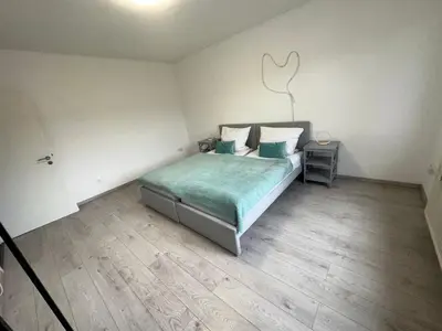 Ein Bett oder Betten in einem Zimmer der Unterkunft Smile Apartment Duisburg