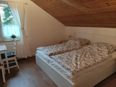 Ein Bett oder Betten in einem Zimmer der Unterkunft Mamat Ferienwohnungen