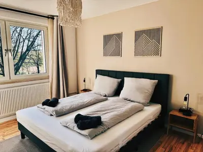 Ein Bett oder Betten in einem Zimmer der Unterkunft The green cow 6P apartment Balcony Smart TV