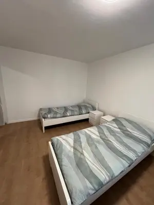 Ein Bett oder Betten in einem Zimmer der Unterkunft Monteurwohnung 9P Hamm Zentral