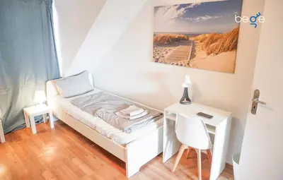 Ein Bett oder Betten in einem Zimmer der Unterkunft BEGE APARTMENTS Company Zone