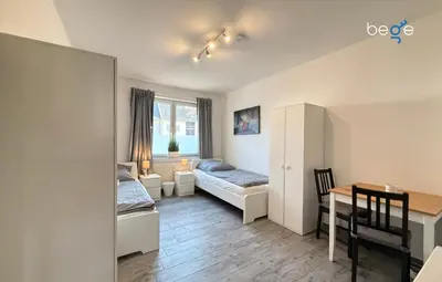 Ein Bett oder Betten in einem Zimmer der Unterkunft BEGE APARTMENTS Company Spot