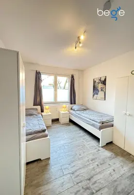 Ein Bett oder Betten in einem Zimmer der Unterkunft BEGE APARTMENTS Company Spot
