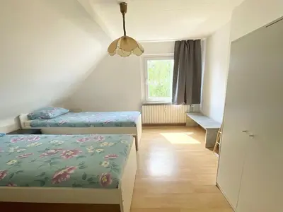 Ein Bett oder Betten in einem Zimmer der Unterkunft Cozy Apartment in Duisburg