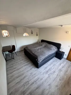 Ein Bett oder Betten in einem Zimmer der Unterkunft Niederrhein Kaue