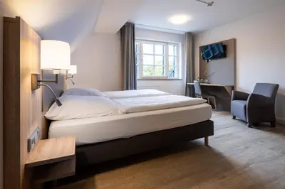 Ein Bett oder Betten in einem Zimmer der Unterkunft Die Wolfsburg