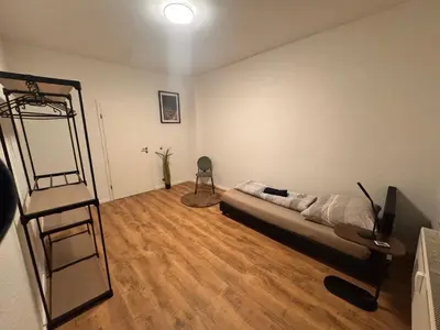 Ein Bett oder Betten in einem Zimmer der Unterkunft A&V Apartments Arena Schalke