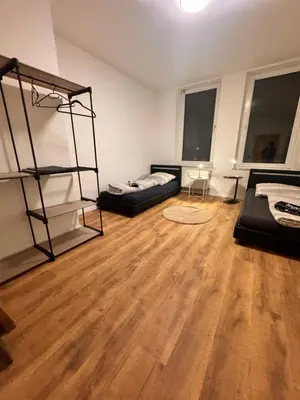 Ein Bett oder Betten in einem Zimmer der Unterkunft A&V Apartments Arena Schalke