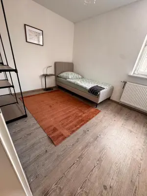 Ein Bett oder Betten in einem Zimmer der Unterkunft A&V Apartments Iserlohn Kiki Karl-Arnold