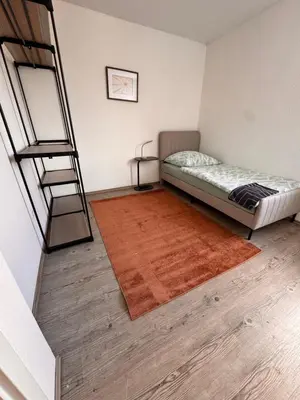 Ein Bett oder Betten in einem Zimmer der Unterkunft A&V Apartments Iserlohn Kiki Karl-Arnold