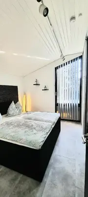 Ein Bett oder Betten in einem Zimmer der Unterkunft Charmantes Haus mit Gartenoase