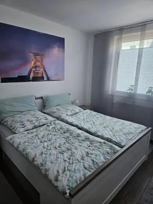 Ein Bett oder Betten in einem Zimmer der Unterkunft FeWo Ruhrpott