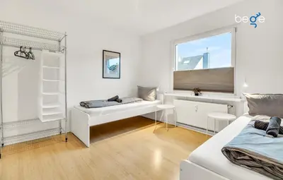 Ein Bett oder Betten in einem Zimmer der Unterkunft BEGE APARTMENTS CompanyLife