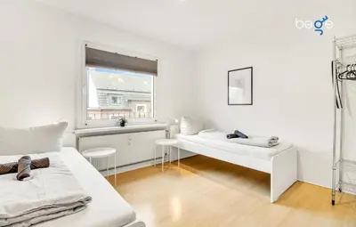 Ein Bett oder Betten in einem Zimmer der Unterkunft BEGE APARTMENTS CompanyLife