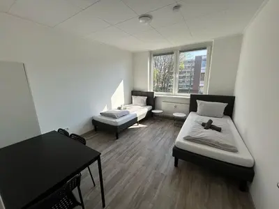 Ein Bett oder Betten in einem Zimmer der Unterkunft Monteurswohnung - Dorsten - 6 Personen