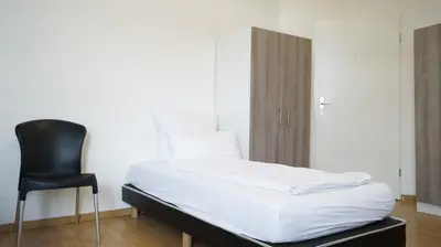 Ein Bett oder Betten in einem Zimmer der Unterkunft DIM Monteurzimmer Duisburg