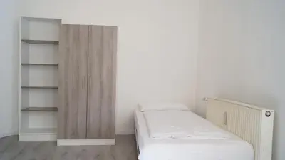 Ein Bett oder Betten in einem Zimmer der Unterkunft DIM Monteurzimmer Duisburg