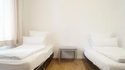 Ein Bett oder Betten in einem Zimmer der Unterkunft DIM Monteurzimmer Duisburg
